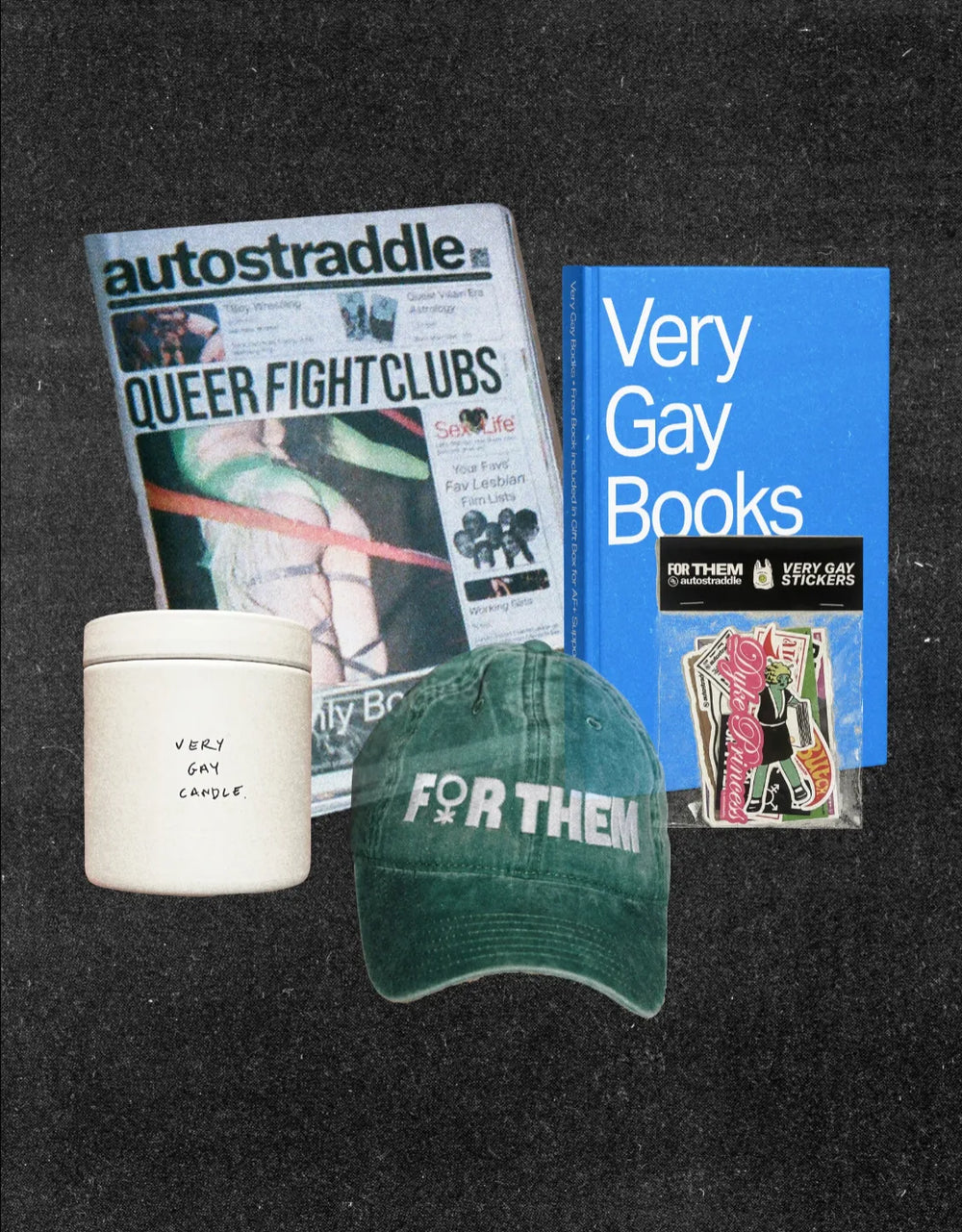 The patron gift box: Autostraddle magazine, Very Gay Books, Very Gay Candle, For Them cap and Very Gay Stickers